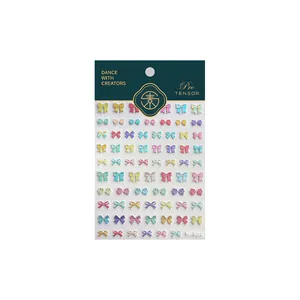 3D bow nail art stickers in macaron colors with glitter finish and adhesive backing