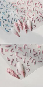 Detailed close-up of 3D embossed pink snake nail art stickers and their application.