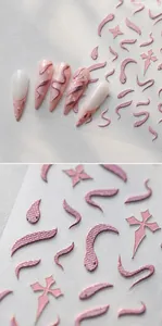 Macro view of 3D embossed pink laser snake and star nail stickers with metallic textures