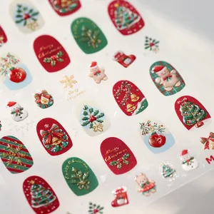 3D embossed Christmas nail stickers with festive red green trees and gold bells