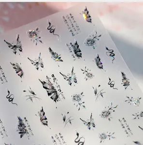Detailed holographic nail stickers featuring ink butterflies, roses and calligraphy