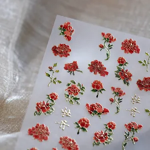 Detail of 5D embossed red peony nail stickers with golden lines and Chinese characters