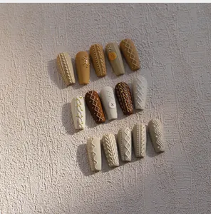 Detailed view of 3D textured cable knit sweater patterns on autumn coffin nail stickers