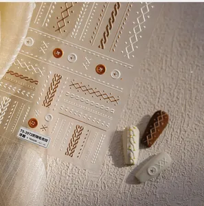 Detailed 3D embossed cable knit nail stickers featuring coffee-colored sweater patterns
