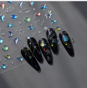 Close-up of 3D aurora laser nail stickers with celestial moon and star relief patterns