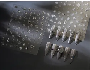 Detail of silver snowflake nail stickers TL-303 showing winter crystal patterns