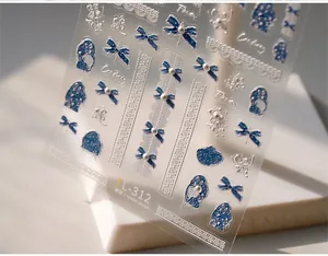 Macro shot of 3D embossed nail stickers TL-312 with blue bows, lace, and pearls