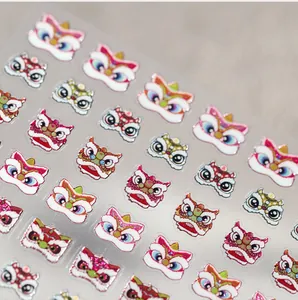 Macro detail of textured matte lion dance nail stickers with silver glitter accents