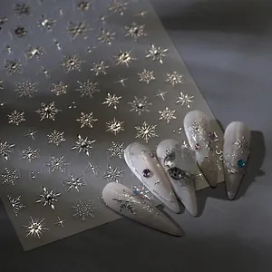 Metallic silver snowflake nail stickers with crystal accents for winter nail art designs