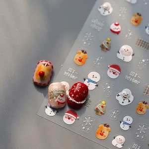 3D Christmas nail art stickers with snowman, reindeer, and snowflakes for holiday manicure