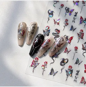 Macro view of holographic butterfly and rose nail stickers with laser metallic luster