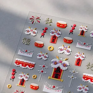 Macro shot of 3D embossed New Year nail art stickers with festive Chinese motifs