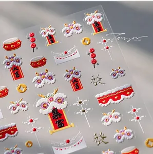 Detailed macro view of 5D embossed nail art stickers with traditional lion dance motifs
