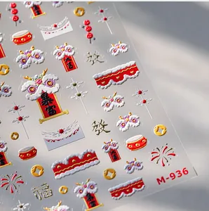 Macro shot of 3D embossed New Year nail stickers M-936 with gold lion and lucky patterns