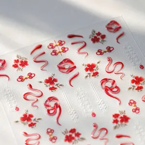 5D embossed nail art stickers with red snake motifs and Chinese knots for lunar new year