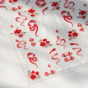 3D embossed nail stickers featuring red snakes and floral Chinese New Year patterns