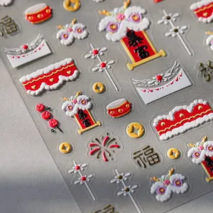 3D embossed Chinese New Year nail art stickers with lion dance and festive gold patterns