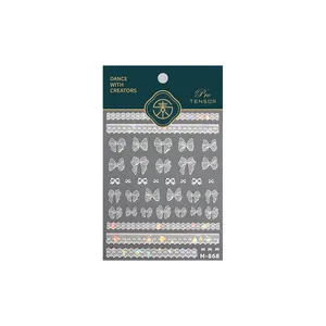 Pro TENSOR M-868 nagelstickers met witte strikken en laser kantpatronen op kaart