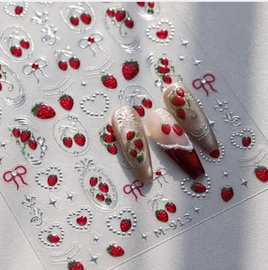 Detailed 3D embossed nail art stickers with red strawberry and silver bow designs