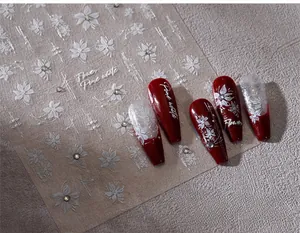Macro detail of white embossed flower nail stickers TL-316 with 3D floral textures
