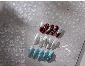 Detail of 3D embossed butterfly and flower nail art stickers with delicate rhinestones