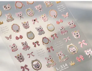 Macro detail of TL-314 nail art stickers with embossed cartoon cats and pink bows