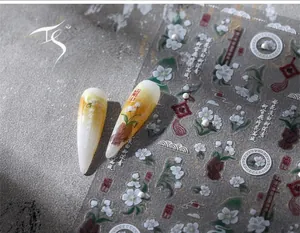 Detail of vintage Chinese style nail art stickers with pear blossoms and elegant patterns