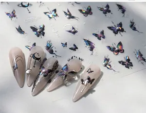 Detail of holographic butterfly nail art stickers with 3D aurora effect and moon patterns