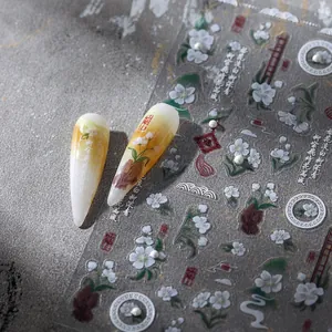 Chinese style nail stickers featuring white floral patterns and classical calligraphy art
