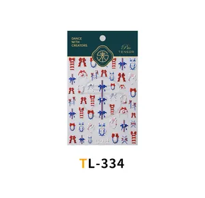 Detail der geprägten TL-334 Nagelsticker mit roten blauen Schleifen und Spitzenmustern