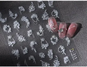 Detail of TL-315 white lace flower nail stickers with pearls on pink cat-eye base