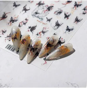 Detailed view of TS-39 black butterfly nail art stickers with small purple rhinestones