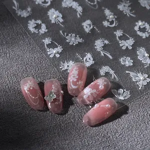 Elegant white floral nail art stickers with 3D embossed butterfly and pearl accents