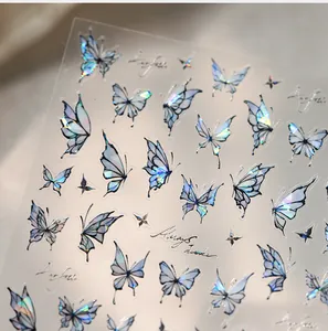 Detail of aurora butterfly nail stickers with holographic laser gold stamping effects