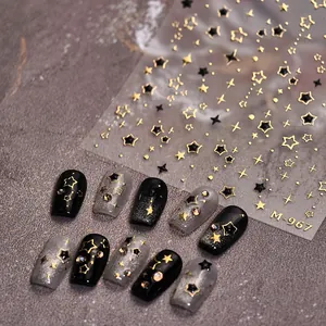 Star nail stickers M-967 featuring gold and black celestial designs on metallic nails