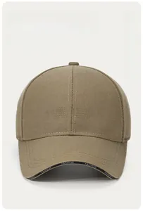 Detail of khaki baseball cap featuring 3D BLACK embroidery and printed fashion brim