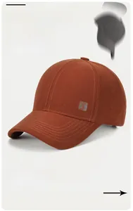 Detail of caramel baseball cap featuring a gray square Good Luck embroidery patch
