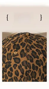 Detail of leopard print baseball cap crown showing stitch quality and ventilation holes