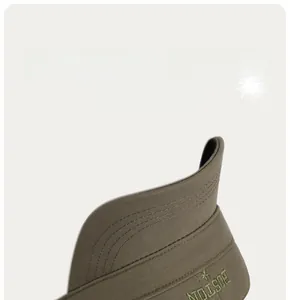 Detail showing the olive green cotton fabric and high-quality BOSTON embroidery on the cap