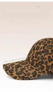 Detail of 8CM extended brim on leopard print baseball cap with distressed edge texture
