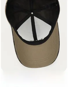 Detail of canvas baseball cap interior featuring mesh lining and FASHION logo sweatband
