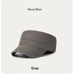Detailed embroidery of BOSTON logo and star on a gray cotton cadet cap with stitched brim