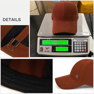Brown cotton baseball cap featuring GOOD LUCK metal side logo and adjustable strap