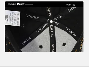Detail of 100% cotton inner lining and washing label of black baseball cap