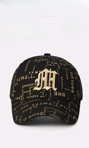 Close-up of black baseball cap with gold 3D embroidery and all-over printed patterns