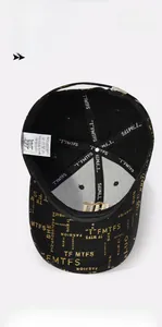 Detail of internal cotton support strips and washing label inside the black baseball cap