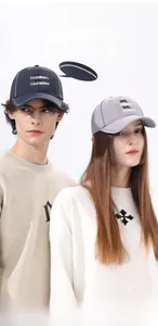 Detail of outdoor baseball cap showing reflective stripes and Travel Californian embroidery