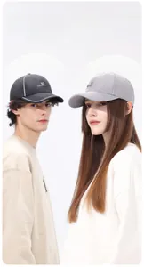 Detail of lightweight quick-dry sports caps with reflective trim and side logo