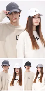 Detail view of quick-dry sports caps in four colors featuring reflective trim and logo
