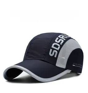 Detail view of quick-drying navy baseball cap featuring breathable mesh and grey reflective trim